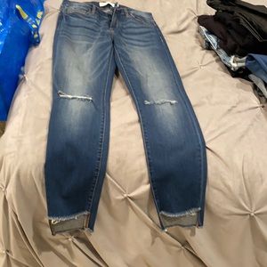 Hidden high rise jeans with rips at the knee